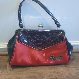 Sourpuss Red And Black Patent Leather Handbag With Spiderweb Detail
